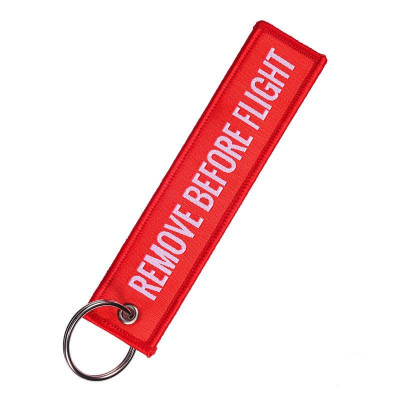 Vyšívaný přívěsek na klíče "Remove Before Flight"